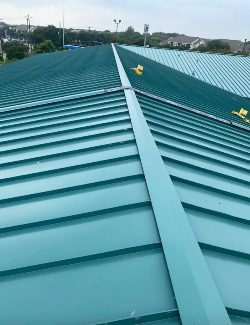 Green commercial metal roof ridge and valley for Metal Roof Repair in Norton Shores